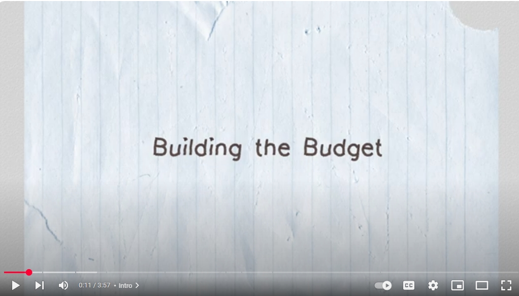 You Tub screenshotof a piece of lined paper with the text, Building a Budget
