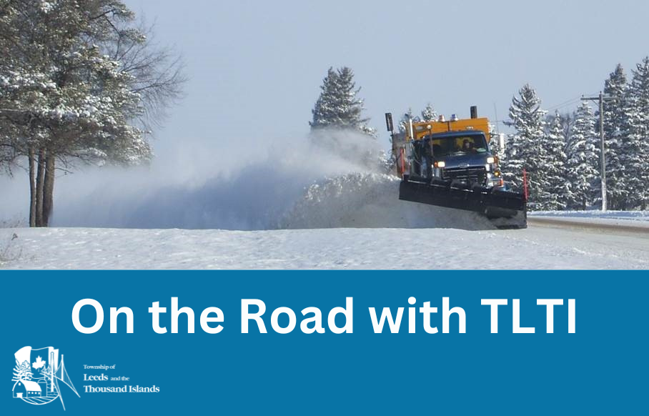 Picture of a snowplow plowing on a snowy day